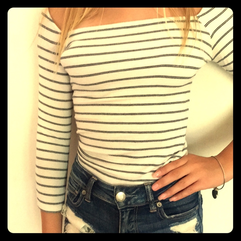 A striped long sleeves off the shoulders shirt.